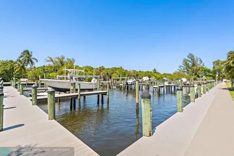 a view of a swimming pool with outdoor seating