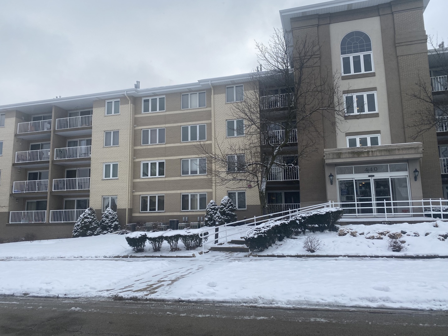 440 East Montrose Avenue, Unit 403 Wood Dale, IL 60191 - Photo 1 of 28 a front view of a building with lot of windows