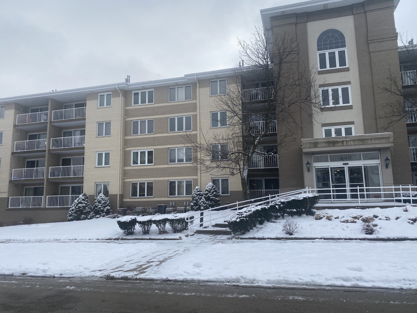 a front view of a building with lot of windows