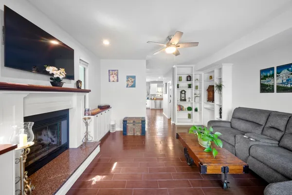 a living room with furniture and a fireplace
