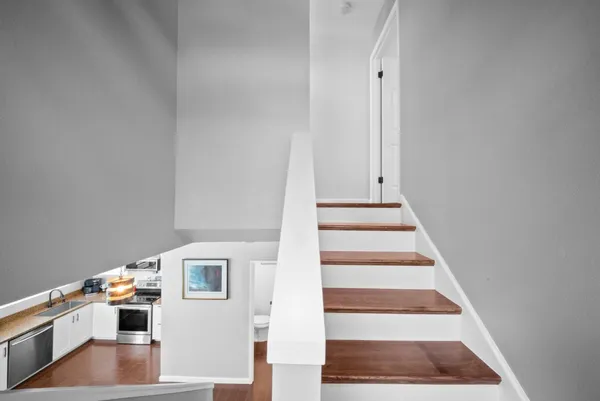 a bedroom with a washer and dryer