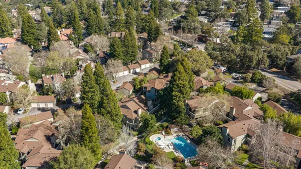 an aerial view of residential house and green space