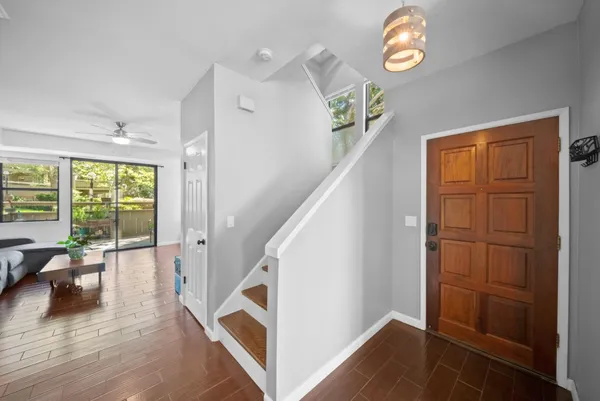wooden floor with a ceiling fan