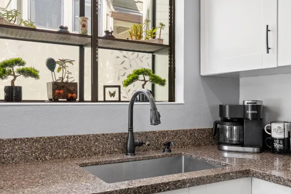 a kitchen with a sink and a window