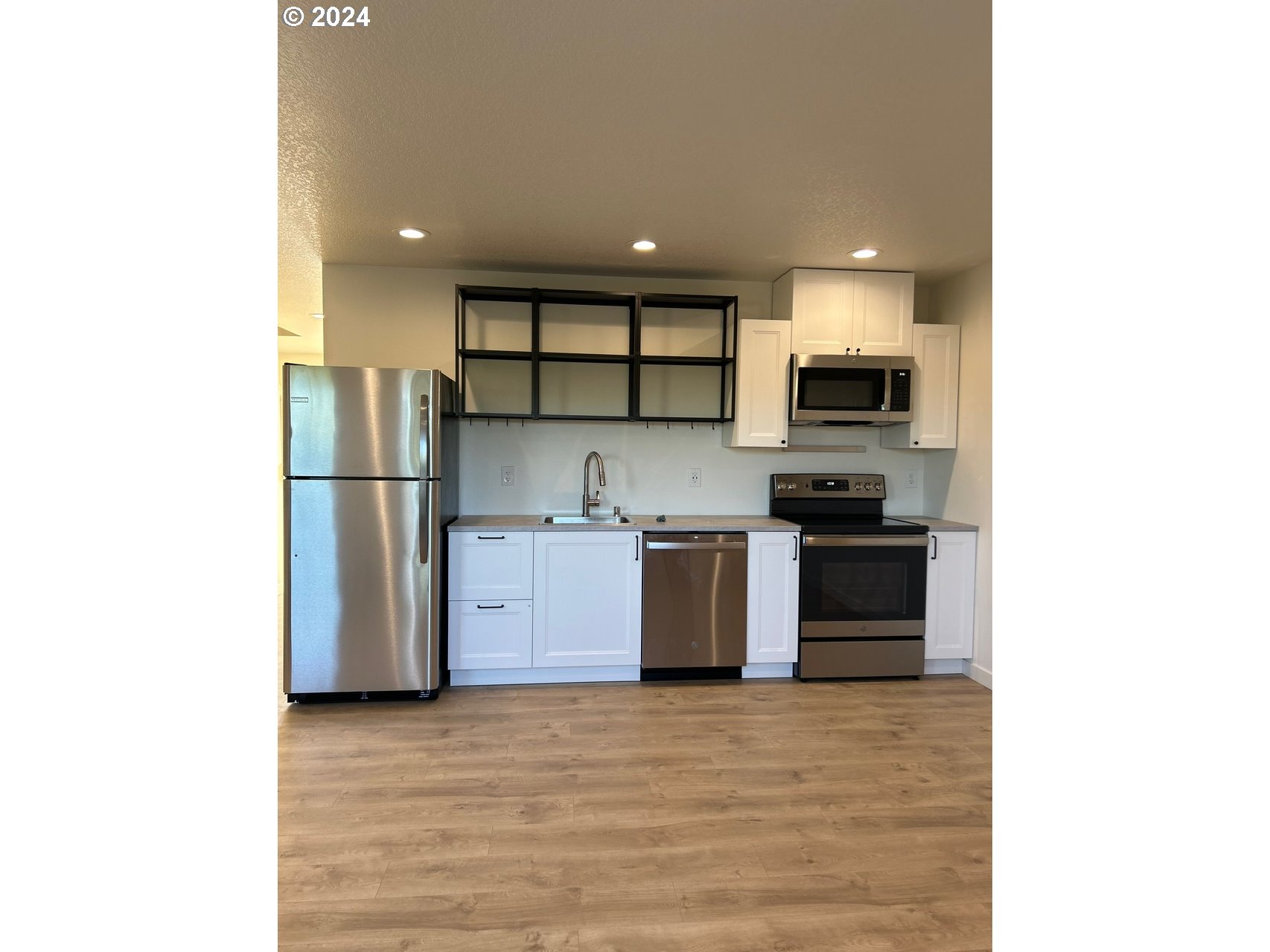 1016 Peach Road Winlock, WA 98596 - Photo 20 of 43 a kitchen with stainless steel appliances granite countertop a refrigerator sink and stove