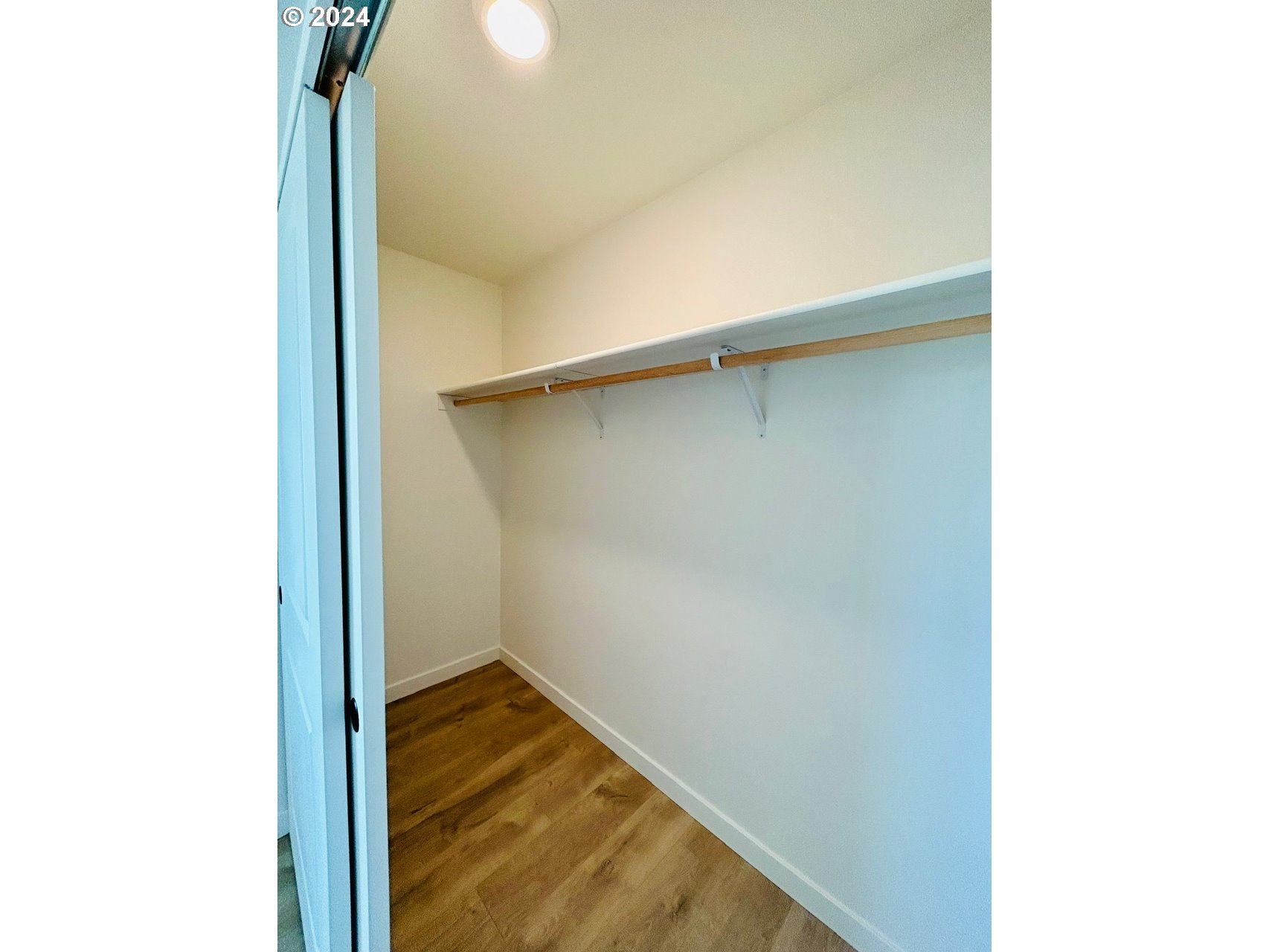 1016 Peach Road Winlock, WA 98596 - Photo 24 of 43 a view of walk in closet with wooden floor