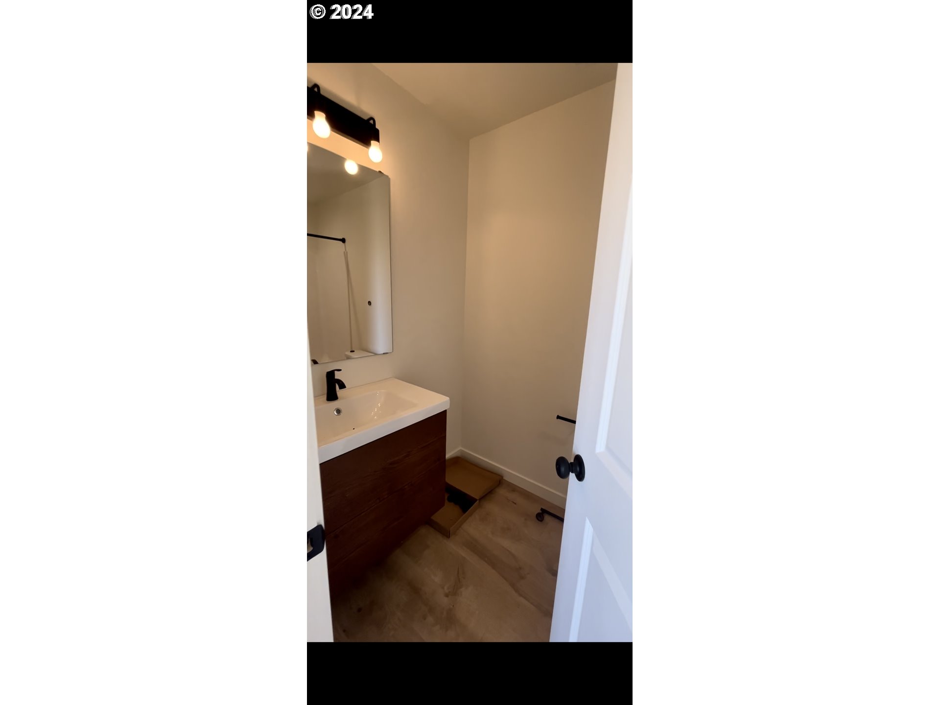 1016 Peach Road Winlock, WA 98596 - Photo 31 of 43 a bathroom with a sink and a mirror