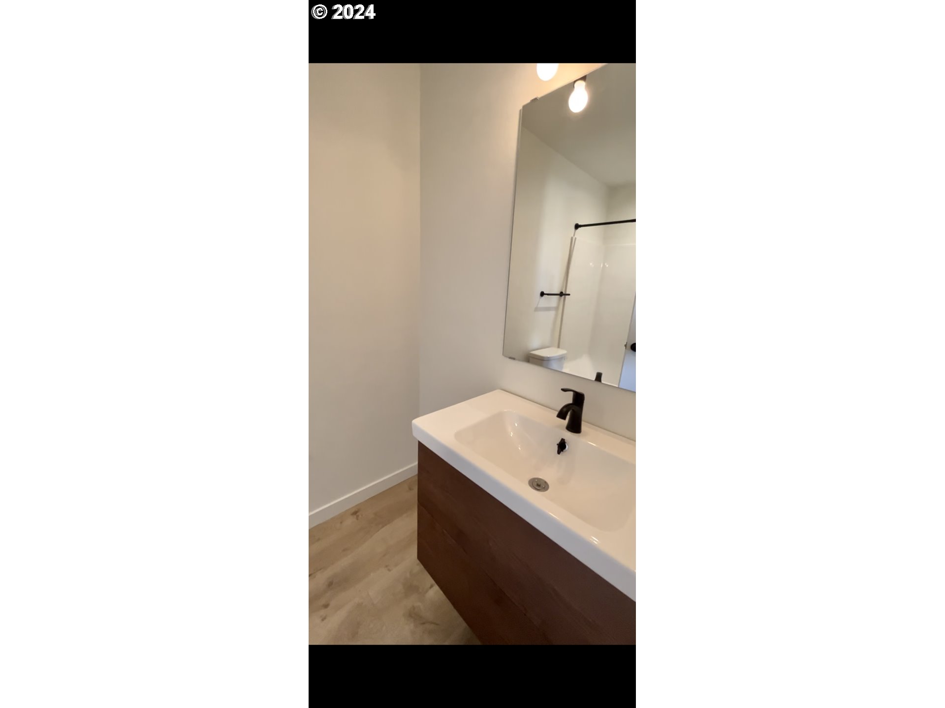 1016 Peach Road Winlock, WA 98596 - Photo 32 of 43 a bathroom with a sink and a mirror