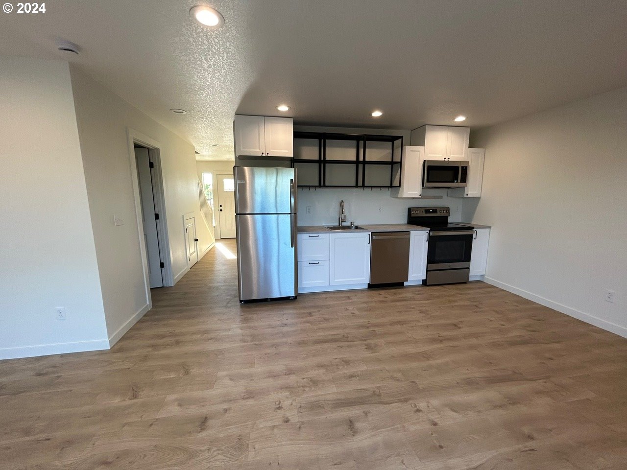 1016 Peach Road Winlock, WA 98596 - Photo 5 of 43 a view of kitchen with stainless steel appliances kitchen island granite countertop a refrigerator and a stove top oven