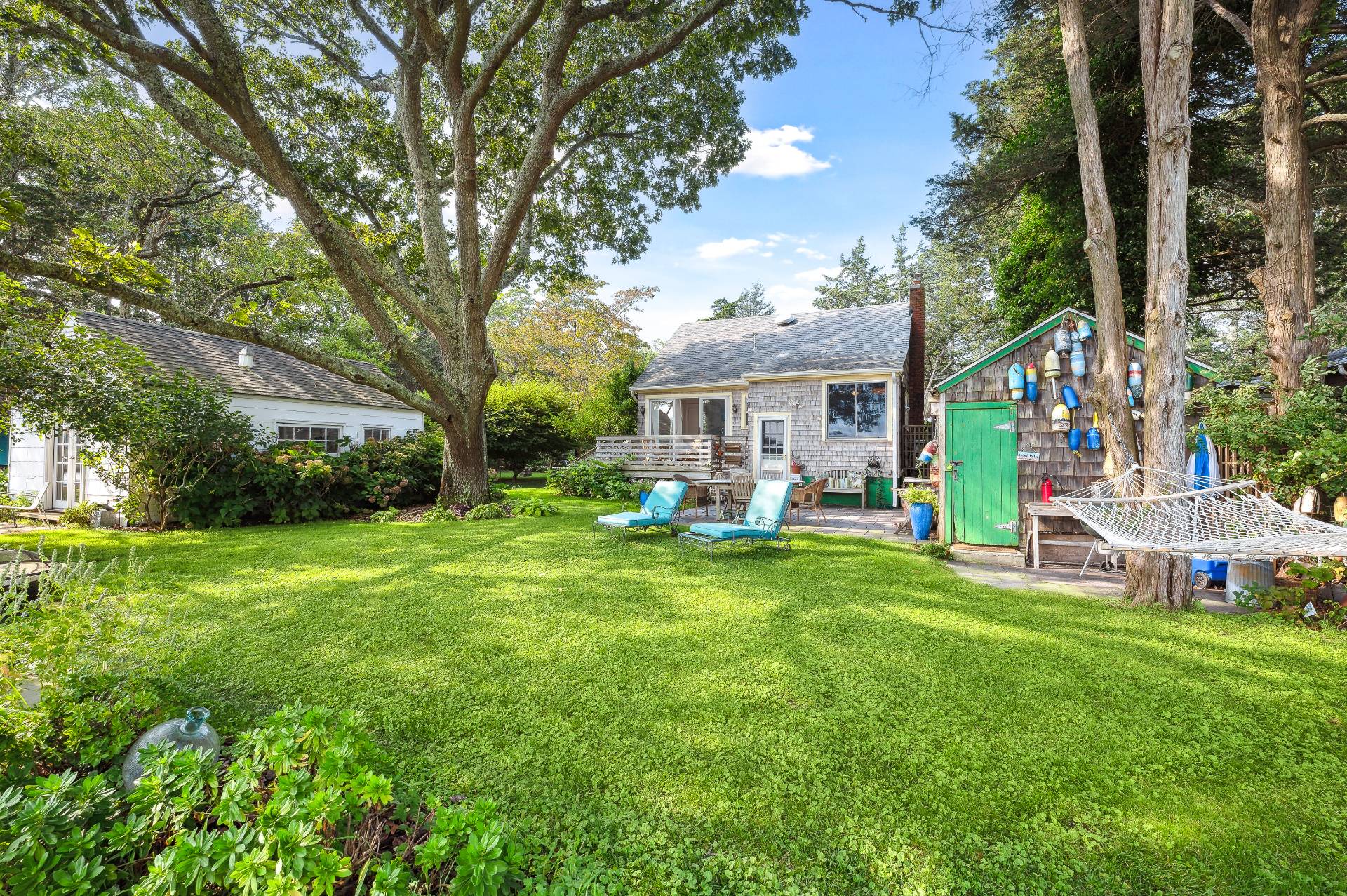 64 Towd Point Road Southampton, NY 11968 - Photo 17 of 21 a view of a house with a back yard