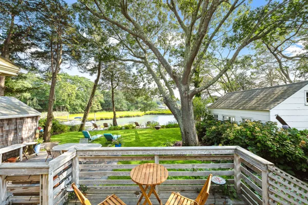 a view of an outdoor sitting area with a lake view