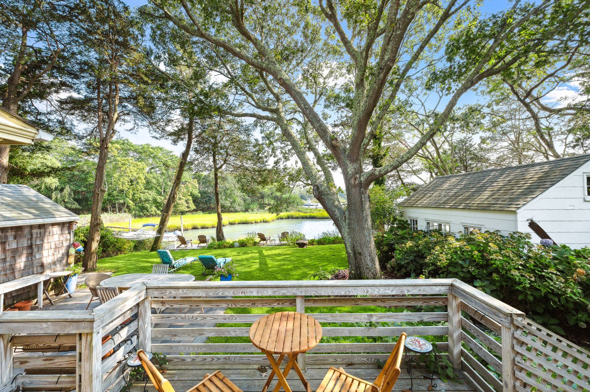 64 Towd Point Road Southampton, NY 11968 - Photo 4 of 21 a view of an outdoor sitting area with a lake view