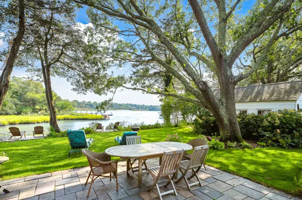 a view of a table and chairs in the garden
