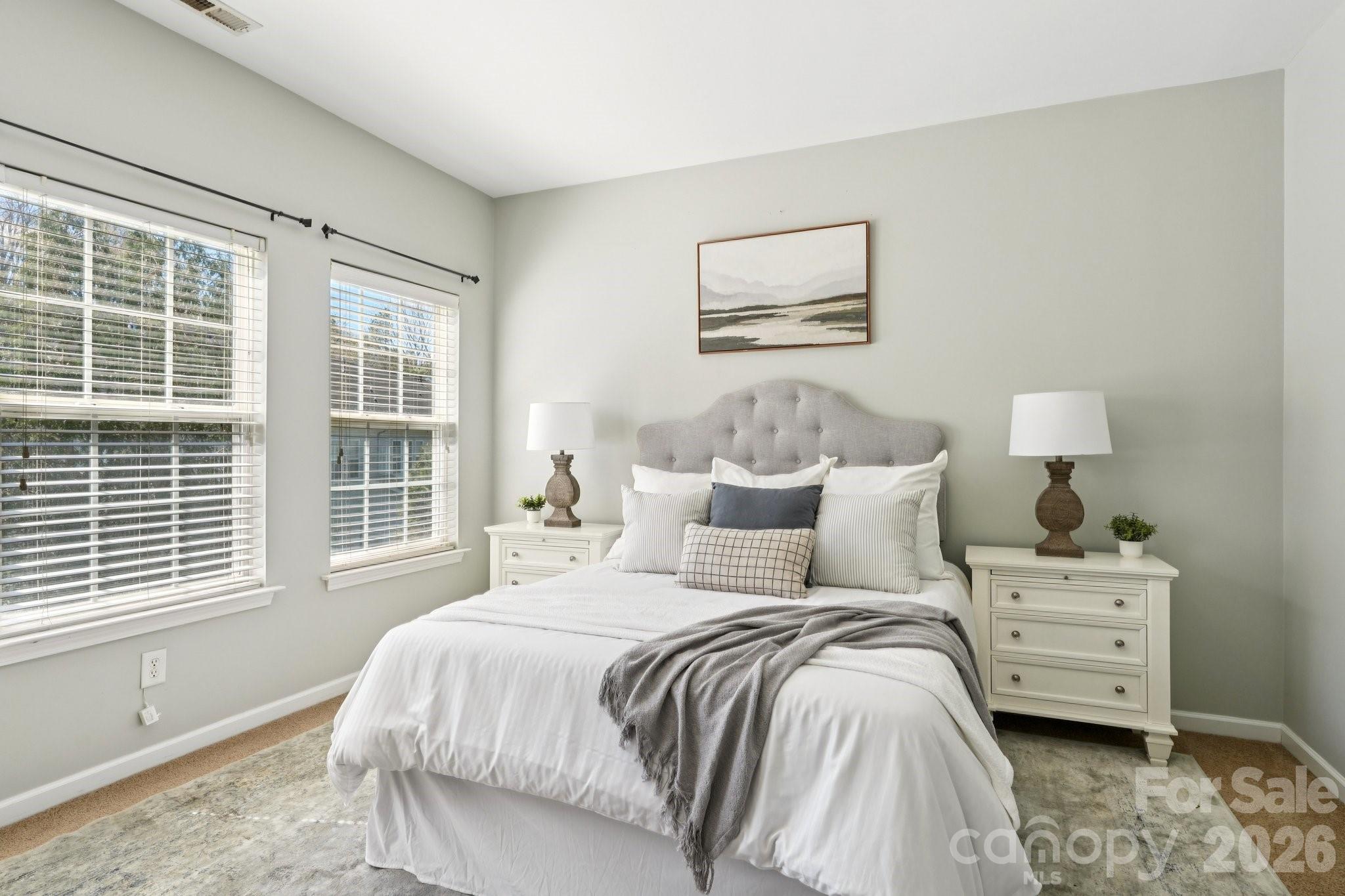 209 Township Drive Fort Mill, SC 29715 - Photo 11 of 31 a bedroom with a bed and a large window