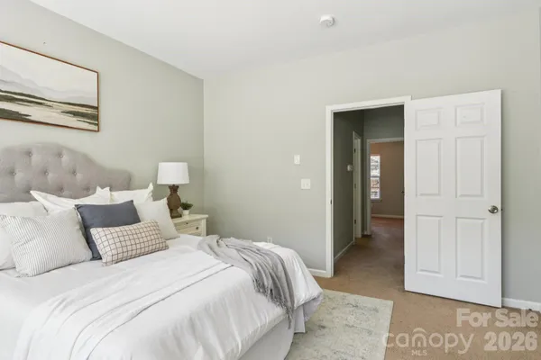 a bedroom with a bed and closet