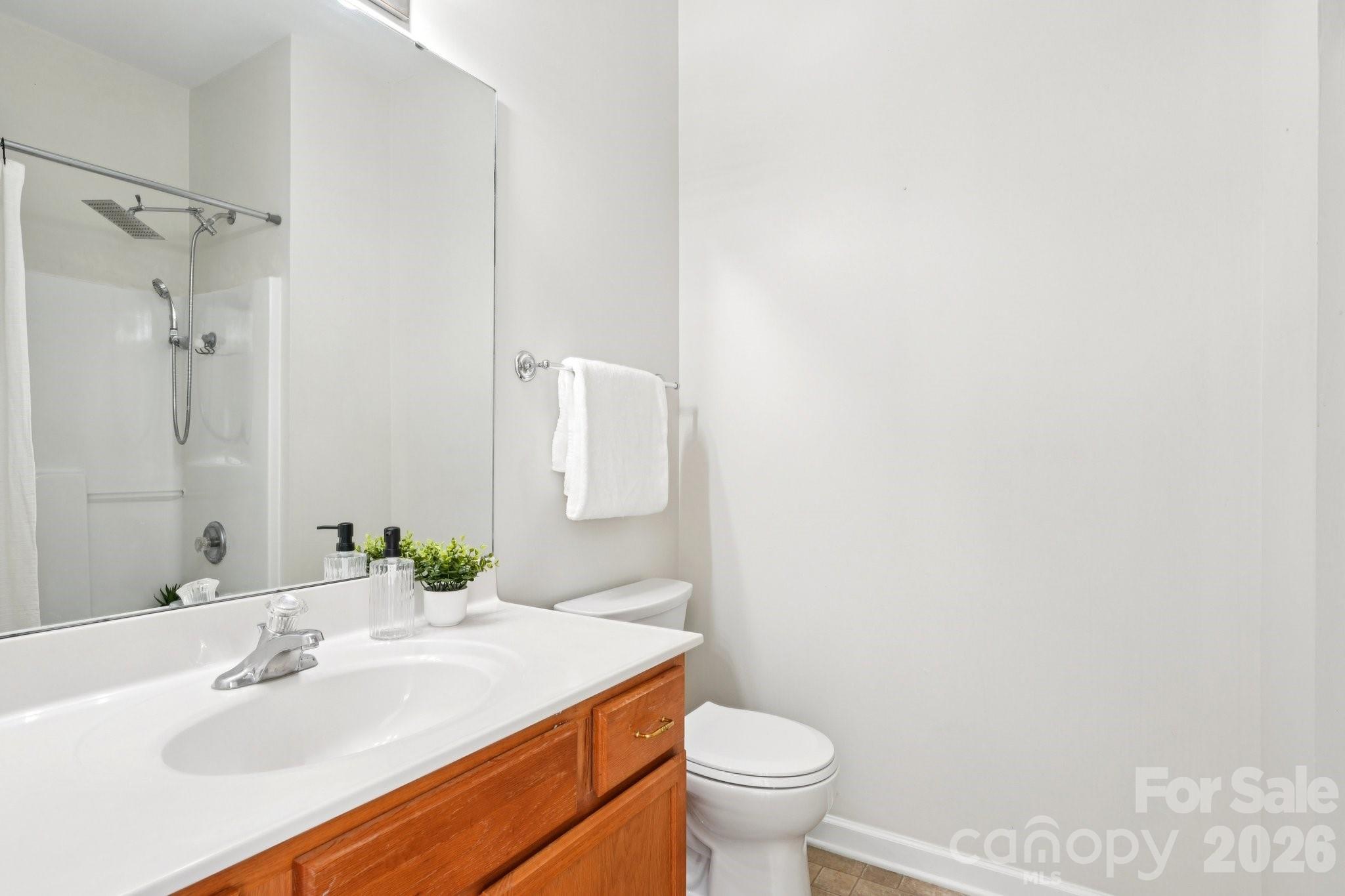 209 Township Drive Fort Mill, SC 29715 - Photo 14 of 31 a bathroom with a sink toilet and shower