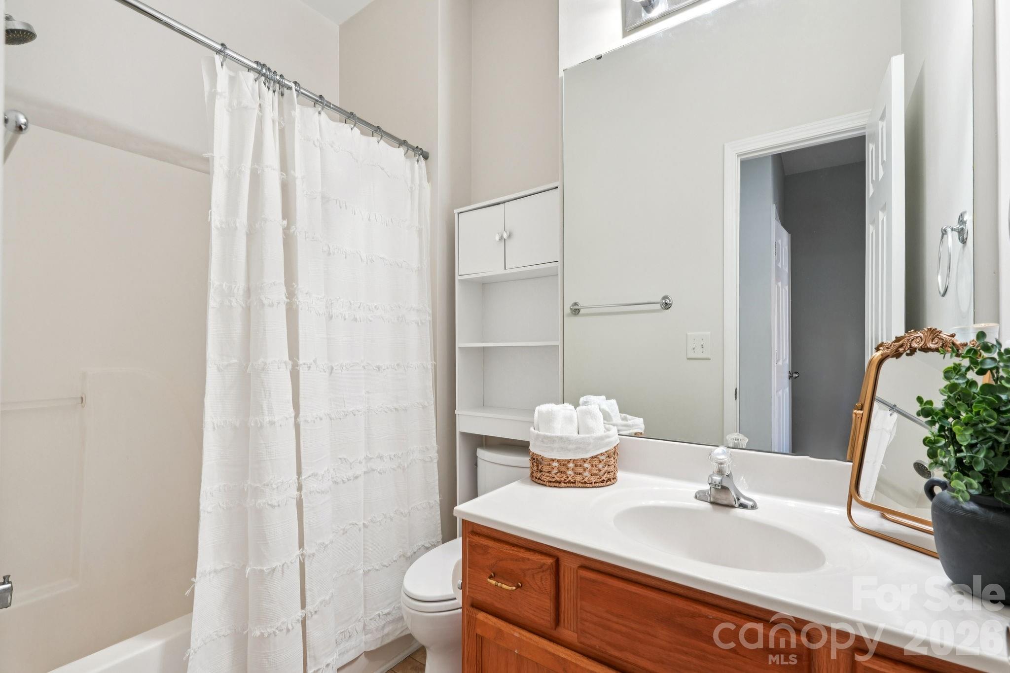 209 Township Drive Fort Mill, SC 29715 - Photo 16 of 31 a bathroom with a sink toilet and shower