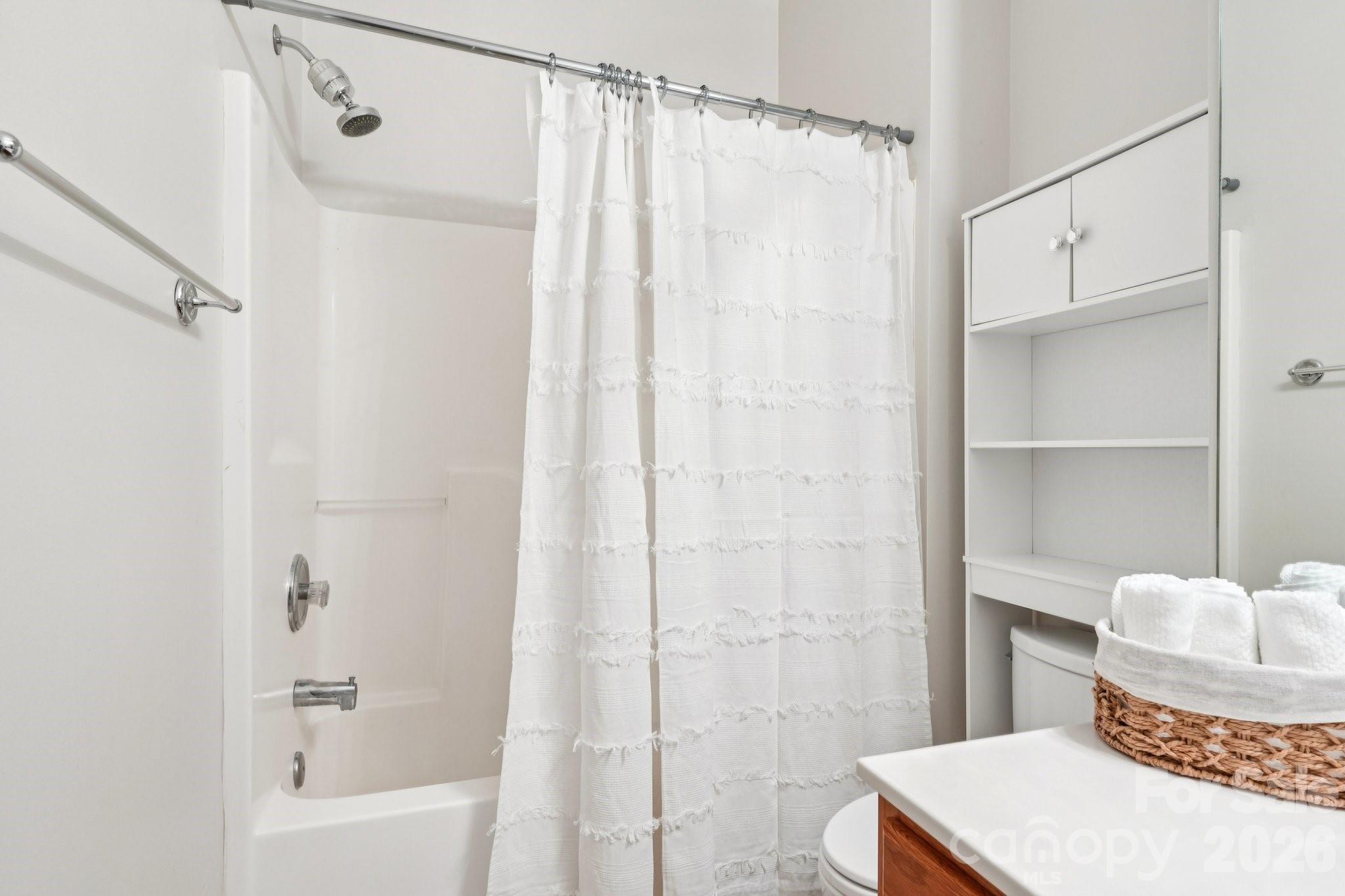 209 Township Drive Fort Mill, SC 29715 - Photo 17 of 31 a bathroom with a shower curtain and a sink