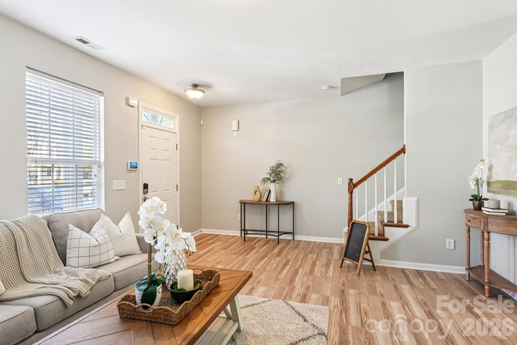 209 Township Drive Fort Mill, SC 29715 - Photo 2 of 31 a living room with furniture and wooden floor