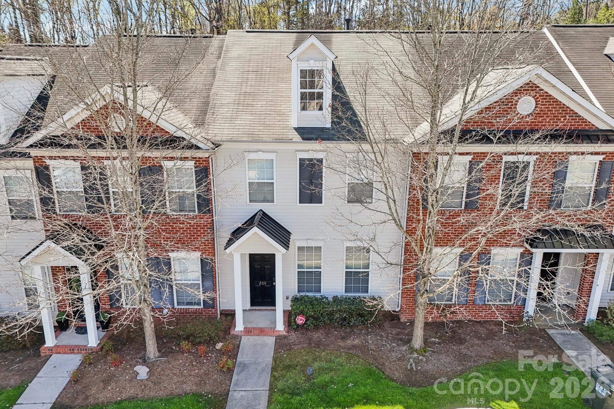 209 Township Drive Fort Mill, SC 29715 - Photo 28 of 31 a front view of a house with a yard