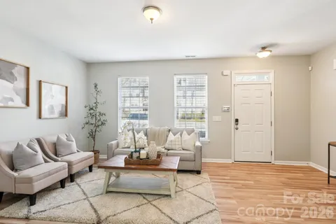a living room with furniture and a large window