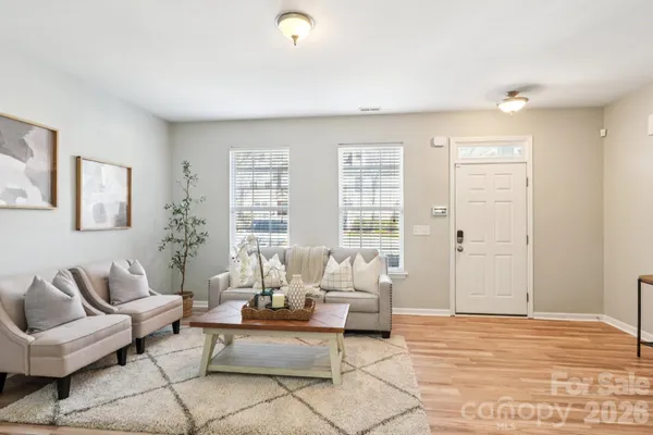 a living room with furniture and a large window