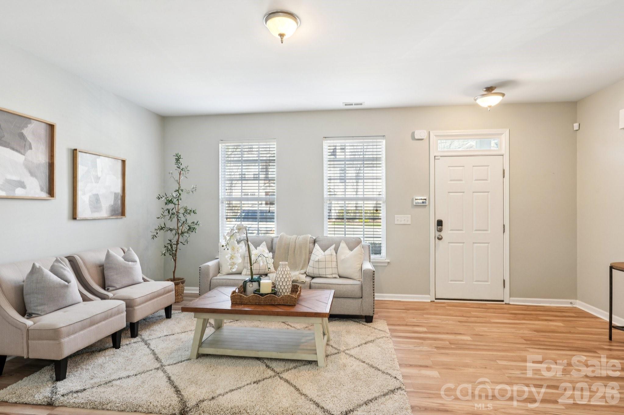209 Township Drive Fort Mill, SC 29715 - Photo 3 of 31 a living room with furniture and a large window