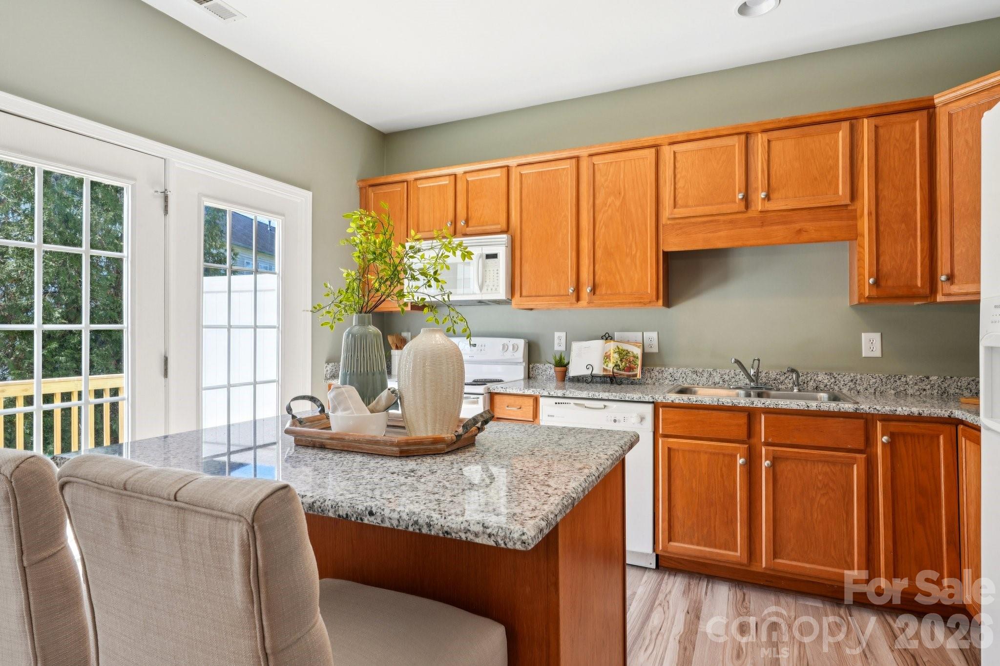 209 Township Drive Fort Mill, SC 29715 - Photo 6 of 31 a kitchen with granite countertop cabinets and window
