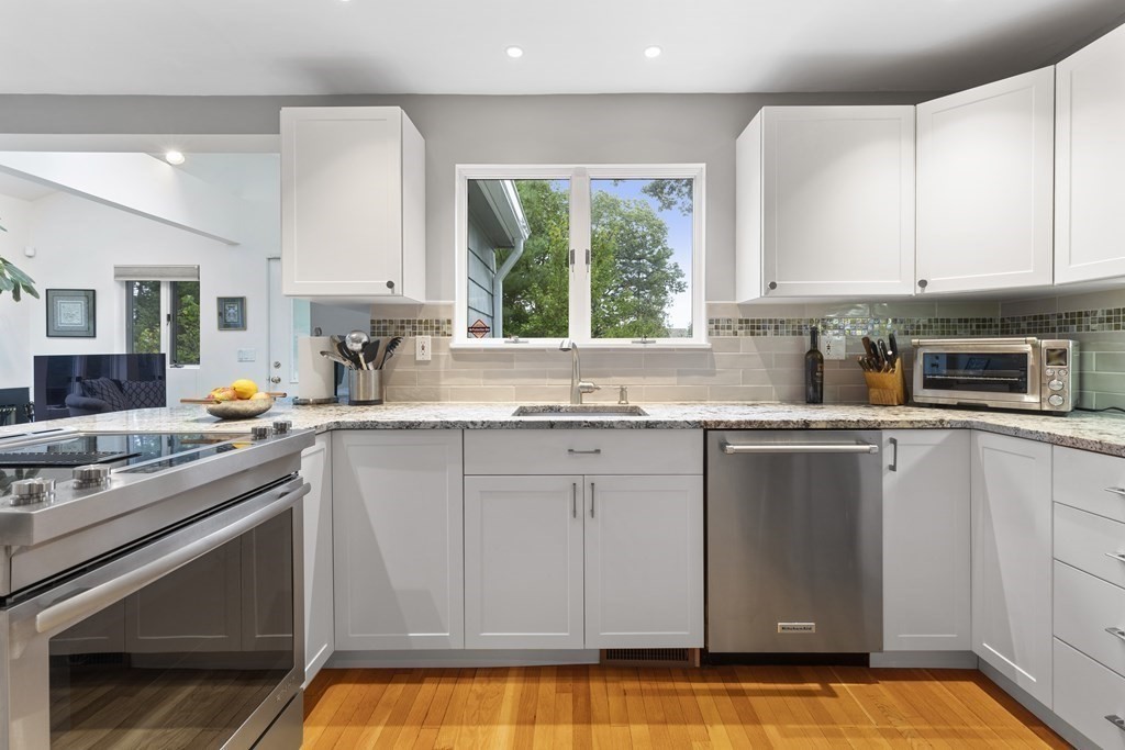 89 Edmands Road Framingham, MA 01701 - Photo 11 of 42 a kitchen with a sink cabinets and window
