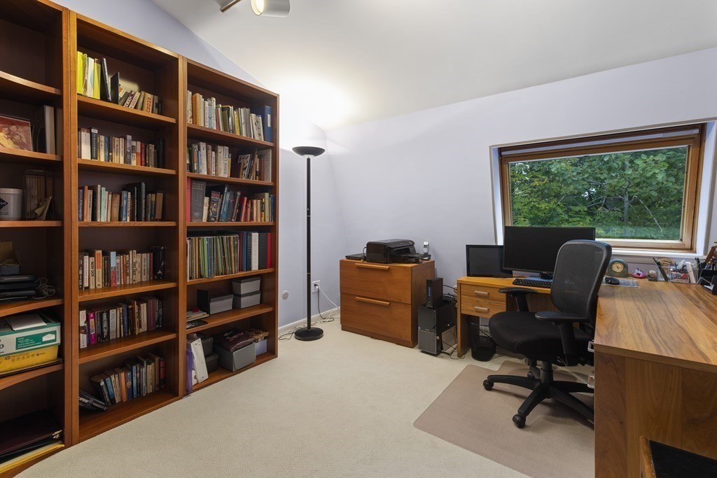 89 Edmands Road Framingham, MA 01701 - Photo 25 of 42 a view of a workspace with furniture and a bookshelf