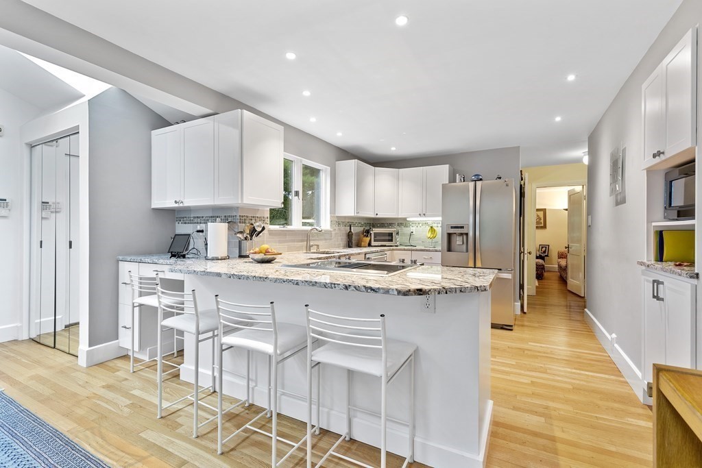 89 Edmands Road Framingham, MA 01701 - Photo 8 of 42 a kitchen with stainless steel appliances kitchen island granite countertop a sink and cabinets