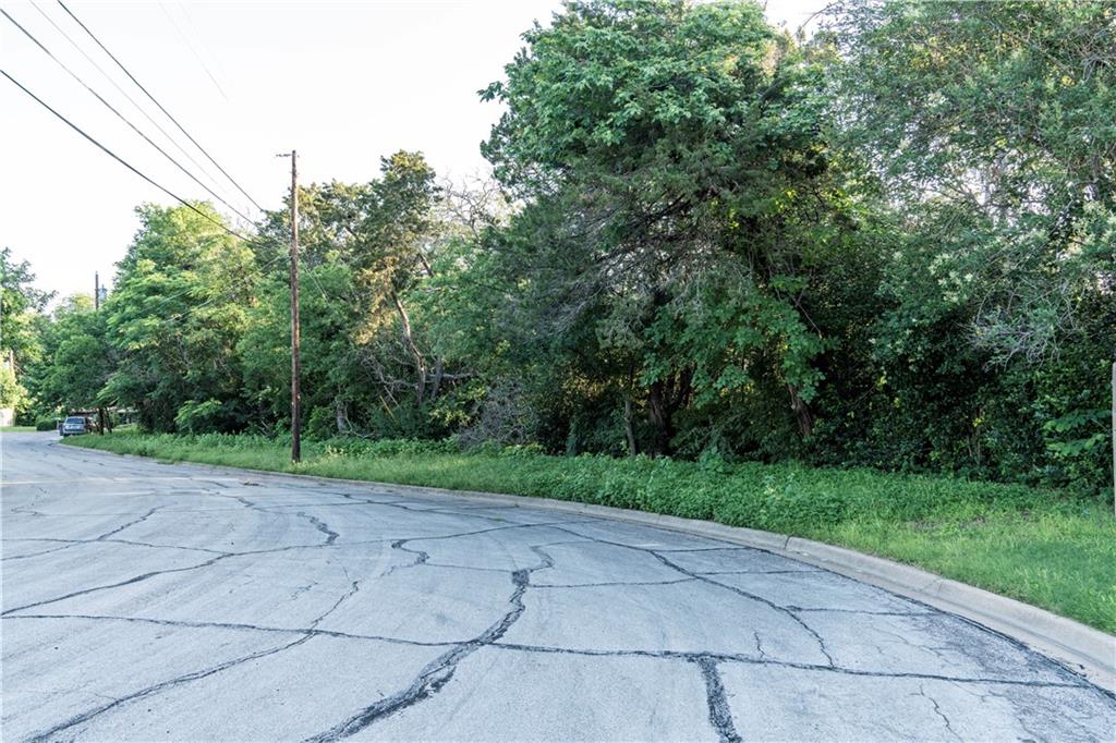 2918 Maple Hill Circle Waco, TX 76708 - Photo 9 of 9 a view of a yard with trees in the background