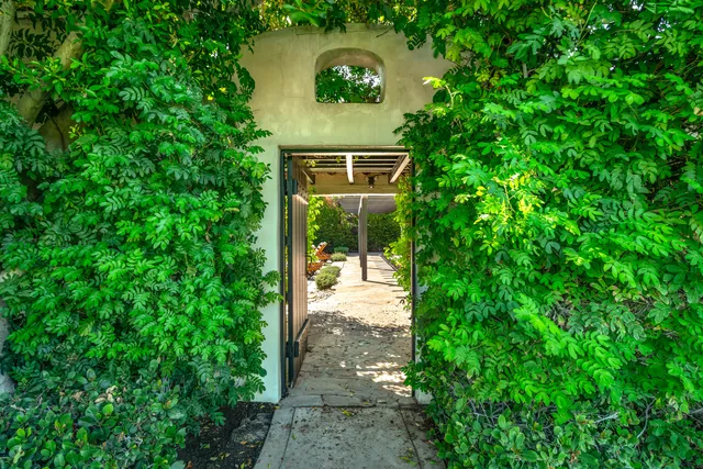 a backyard of a house with outdoor seating