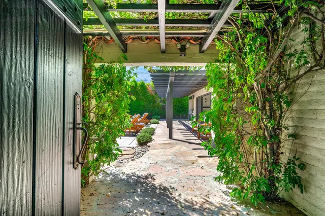 aerial view of a house with swimming pool and a yard