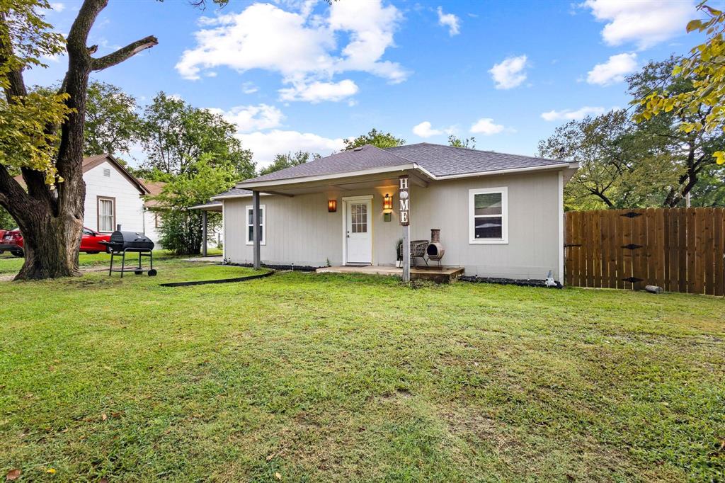 221 Braz Street Bonham, TX 75418 - Photo 2 of 26 a view of a house with a backyard