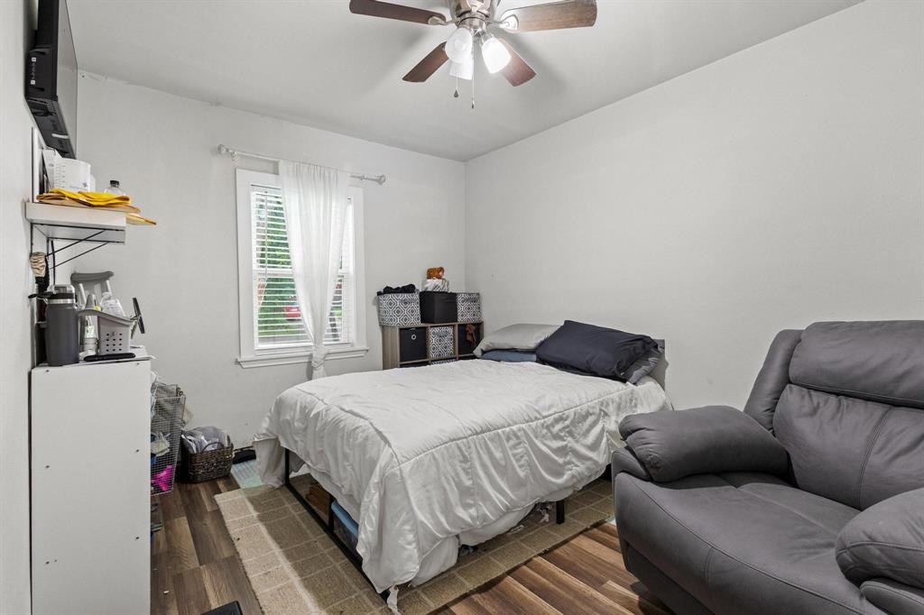 221 Braz Street Bonham, TX 75418 - Photo 22 of 26 a bedroom with a bed furniture and window