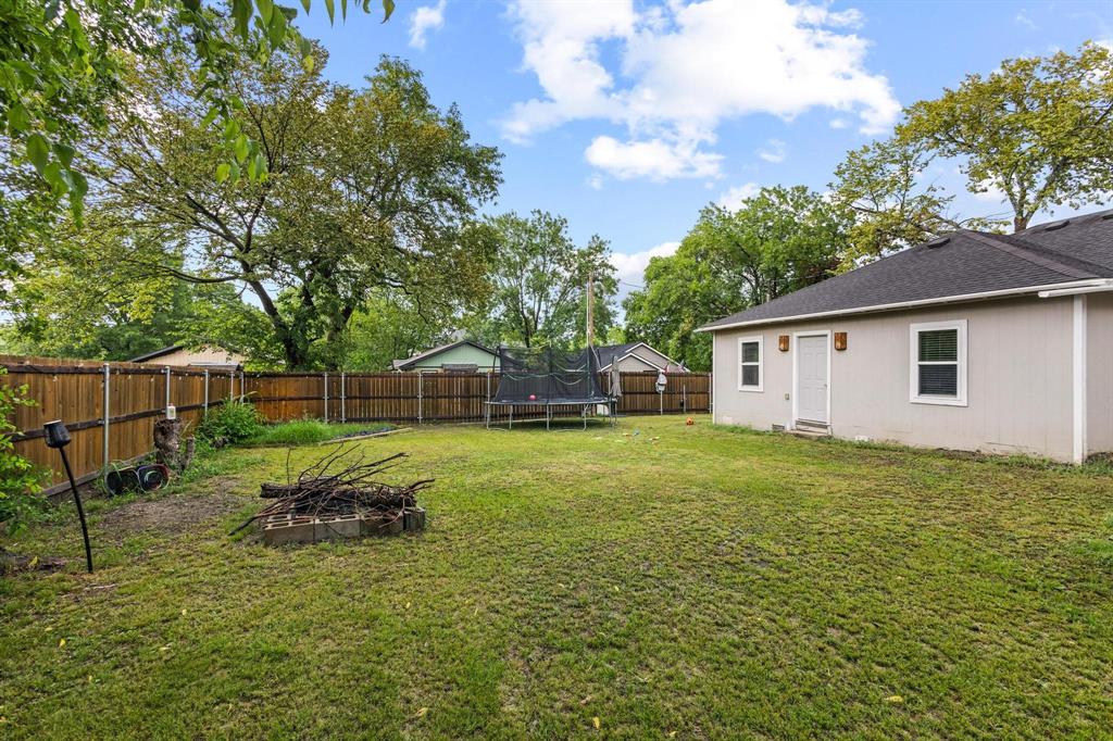221 Braz Street Bonham, TX 75418 - Photo 25 of 26 a house view with a garden space