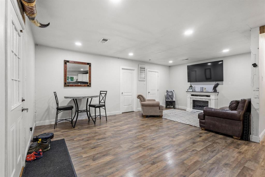221 Braz Street Bonham, TX 75418 - Photo 5 of 26 a living room with furniture and a flat screen tv