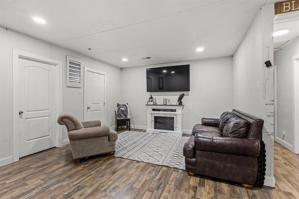 221 Braz Street Bonham, TX 75418 - Photo 6 of 26 a living room with furniture and a flat screen tv