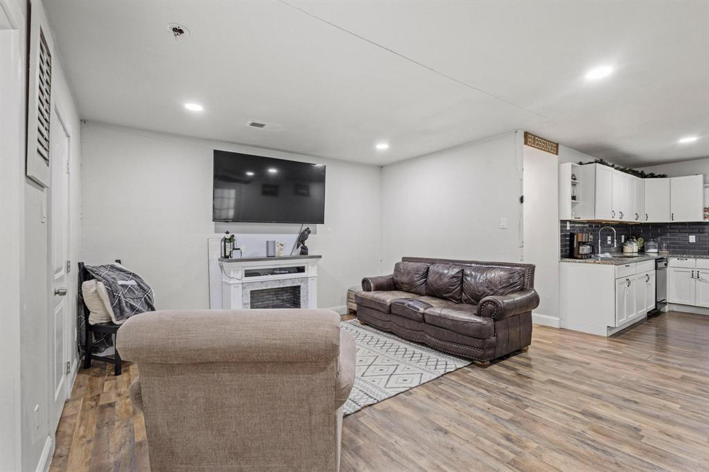 221 Braz Street Bonham, TX 75418 - Photo 8 of 26 a living room with furniture and a flat screen tv
