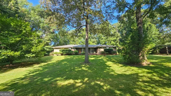 a view of outdoor space with deck and yard