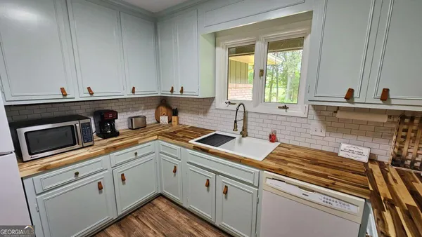 a kitchen with a sink and cabinets