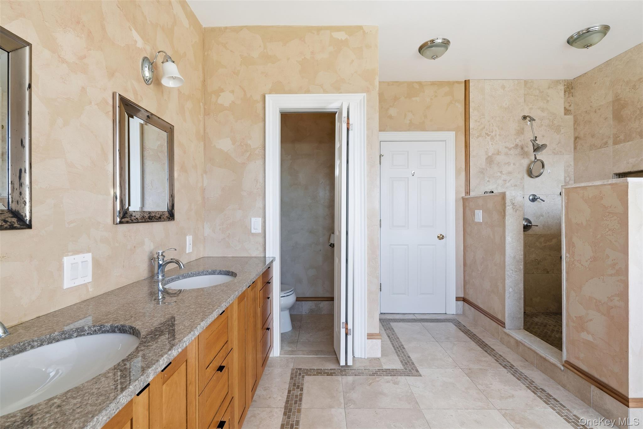 78 Baldwin Road Patterson, NY 12563 - Photo 24 of 50 a bathroom with a granite countertop sink mirror and shower