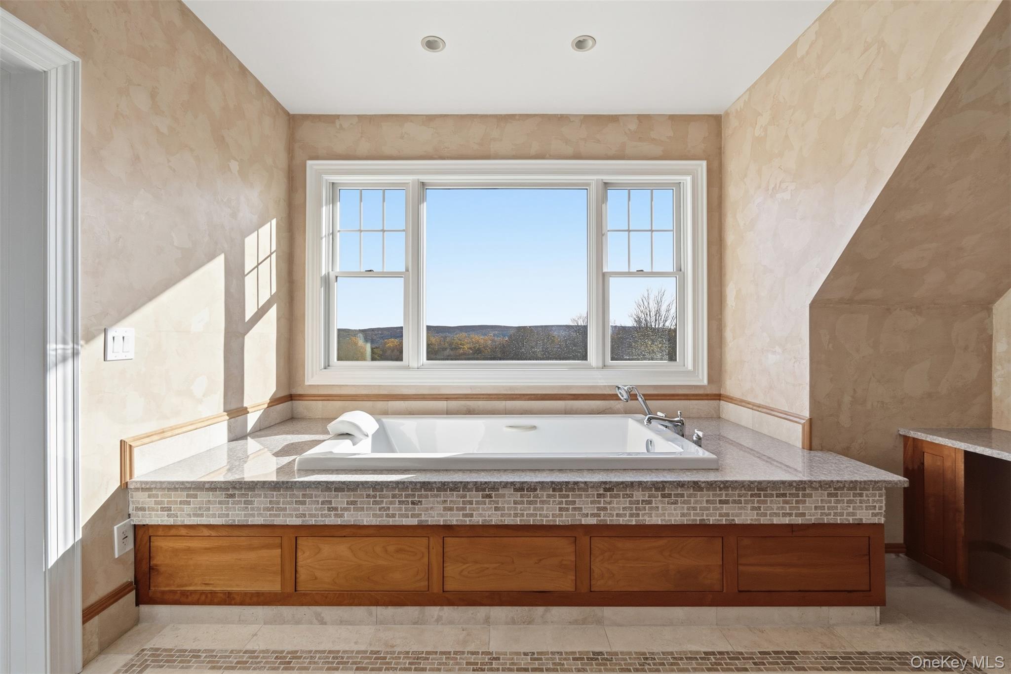 78 Baldwin Road Patterson, NY 12563 - Photo 25 of 50 a bathroom with a granite countertop bathtub and a sink