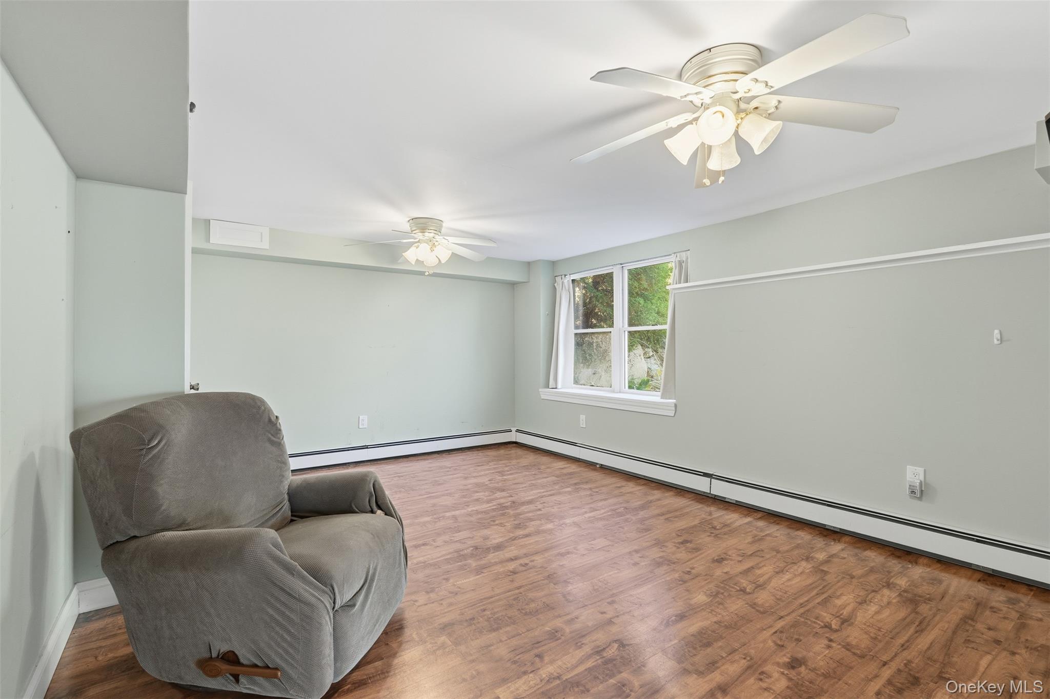78 Baldwin Road Patterson, NY 12563 - Photo 39 of 50 a living room with furniture and a chandelier