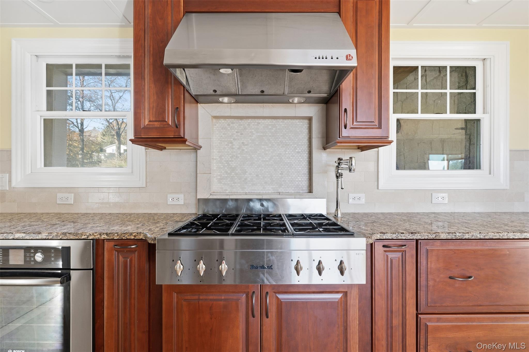 78 Baldwin Road Patterson, NY 12563 - Photo 10 of 50 a kitchen with granite countertop stainless steel appliances a stove and a window