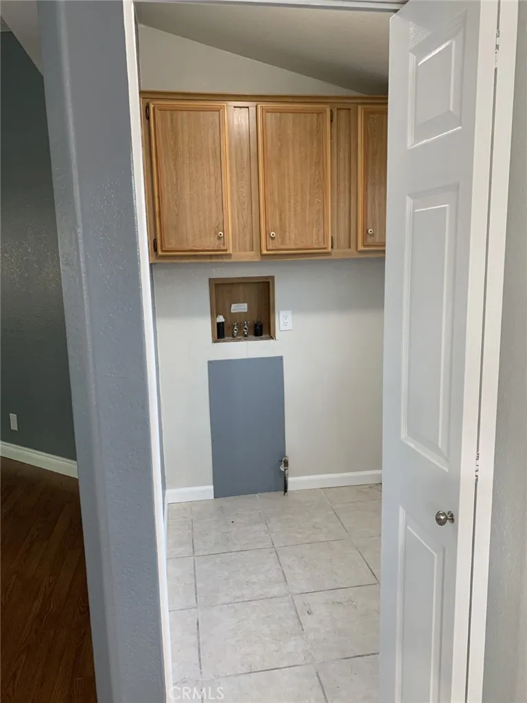 47800 Madison Street Indio, CA 92201 - Photo 18 of 28 a view of kitchen with wooden cabinets