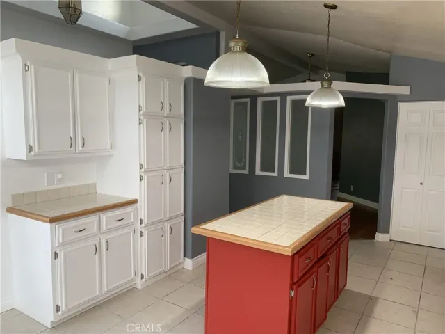 a kitchen with a stove and a refrigerator