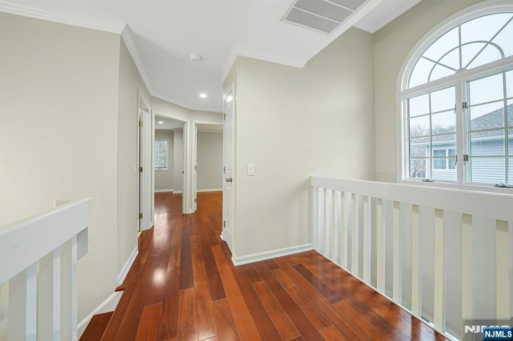 67 Davenport Road Montville, NJ 07045 - Photo 11 of 32 a view of a hallway with wooden floor and staircase