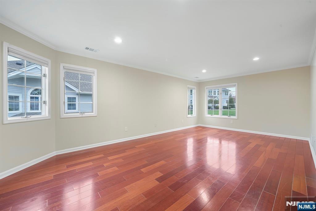 67 Davenport Road Montville, NJ 07045 - Photo 12 of 32 a view of empty room with wooden floor and fan